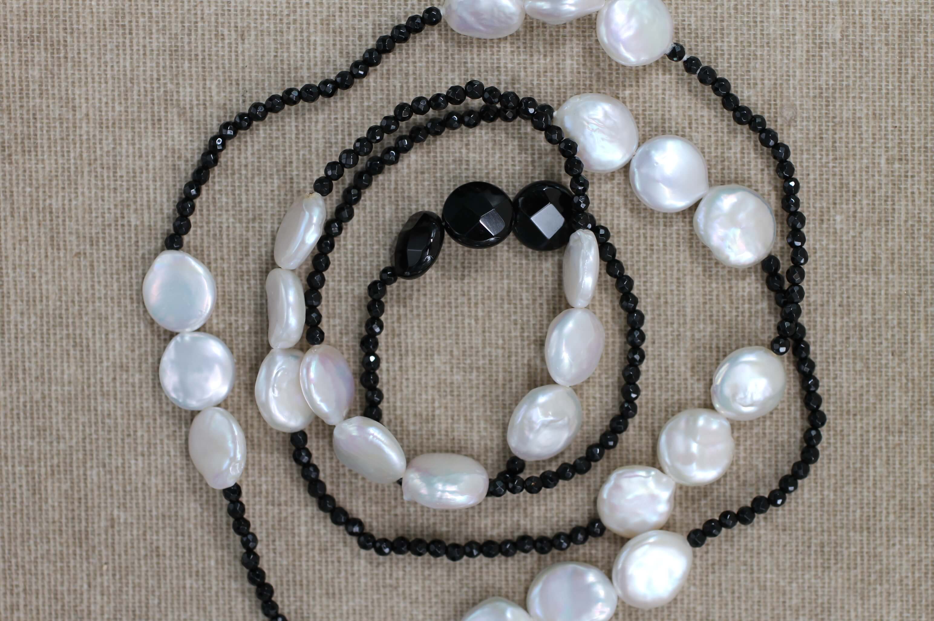 Faceted Onyx and Baroque Pearls necklace.